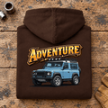 Folded hot chocolate Adventure hoodie back on a workshop bench — car-hd-0002