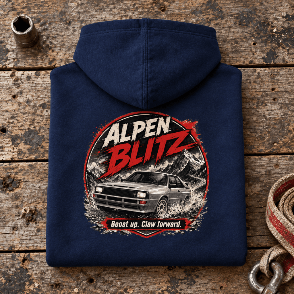 Camberline alpen blitz rally car navy hoodie, folded rear view on a workshop bench with the complete graphic visible.