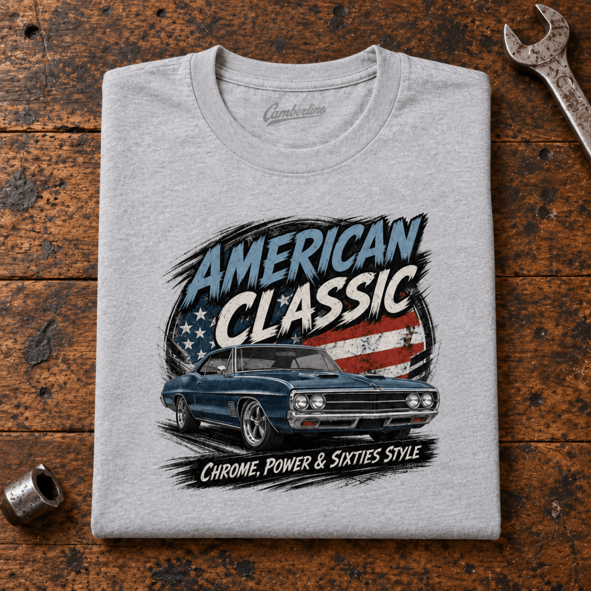 Camberline American Classic 1960s Blue Street Machine Graphic T-Shirt in sport grey, folded front view on a workshop bench with the full graphic visible