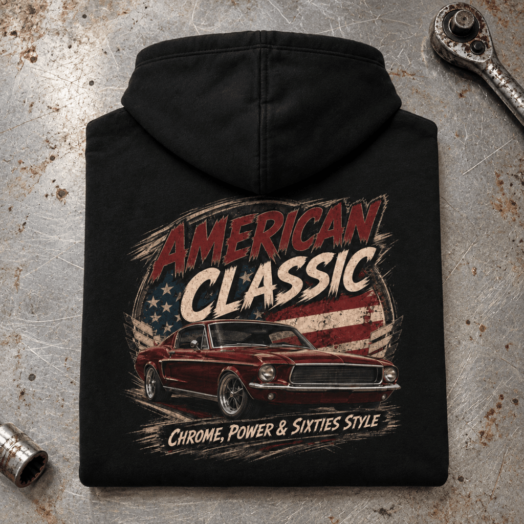 Camberline American Classic 1960s Fastback Graphic Hoodie in black, folded back view on a workshop bench with the full graphic visible
