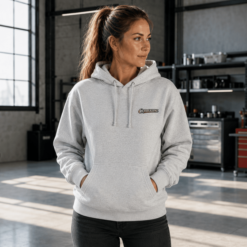 Front view of model wearing the sport grey Camberline hoodie with chest logo