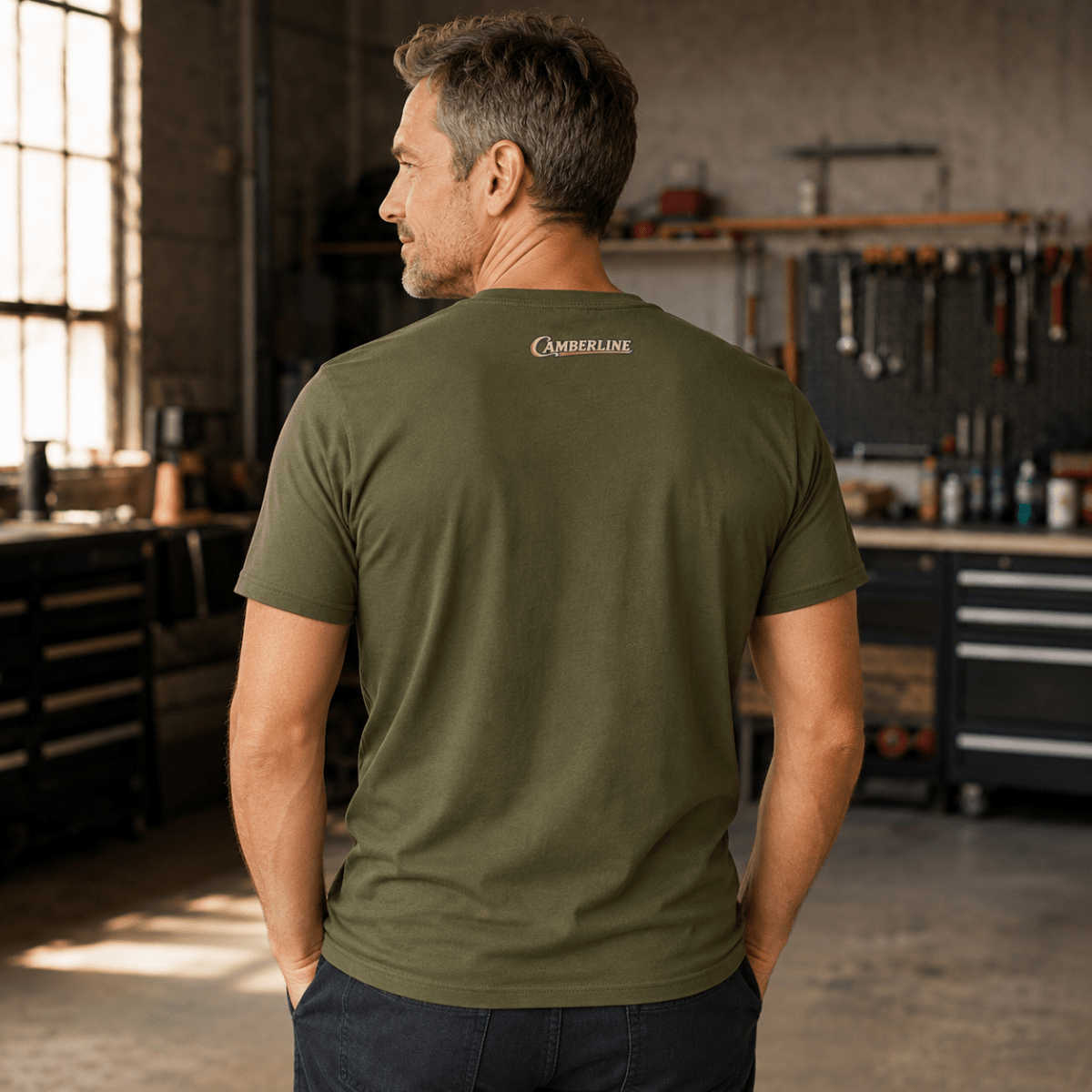 Back view of model wearing the military green Camberline T-shirt with nape print