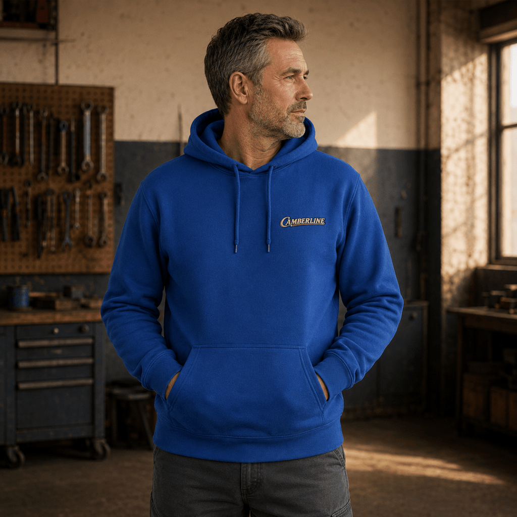 Front view of model wearing the royal blue Camberline hoodie with chest logo
