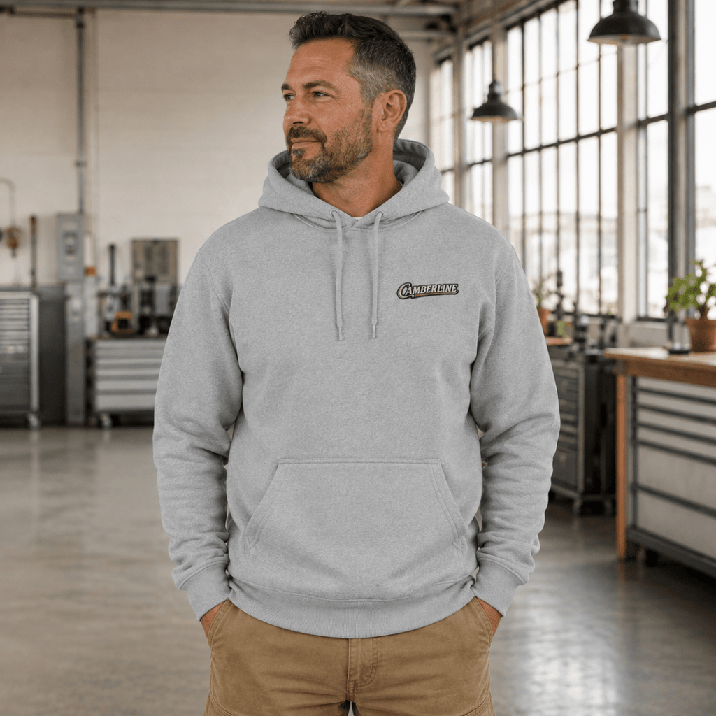 Front view of model wearing the sport grey Camberline hoodie with chest logo