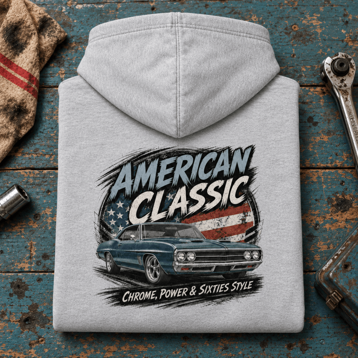 American Classic 1960s Blue Street Machine Graphic Hoodie – Sport Grey, folded back hero on a worn automotive workbench – car-hd-0149