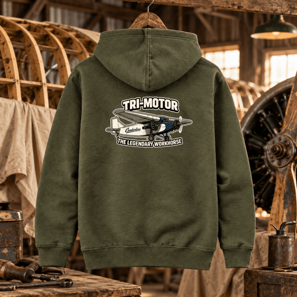 Tri-Motor Workhorse olive aviation hoodie in vintage restoration hangar