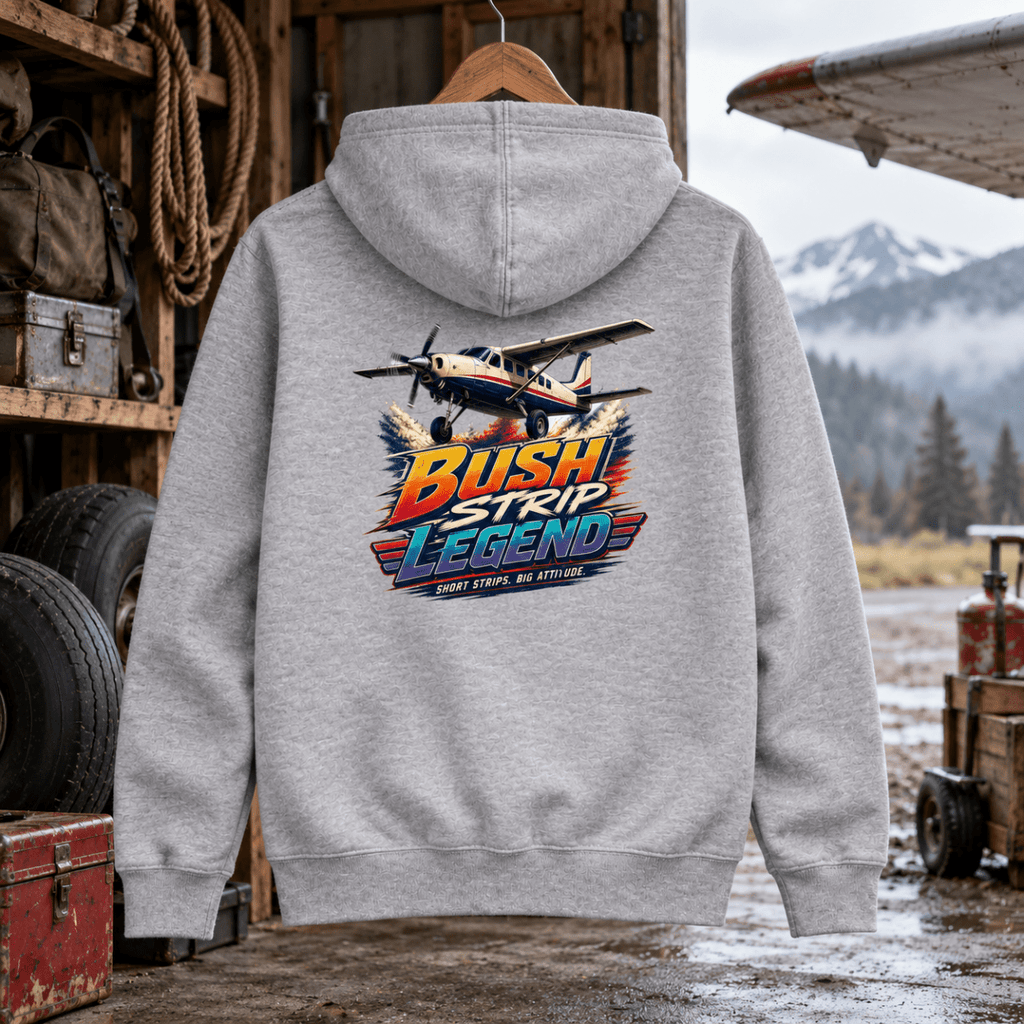 Bush Strip Legend grey aviation hoodie in mountain airstrip equipment shed