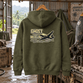Military green Ghost of Medellin DC-3 hoodie in a tropical airstrip workshop