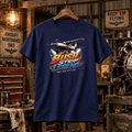 Navy Bush Strip Legend utility aircraft T-shirt in a gritty vintage aircraft workshop