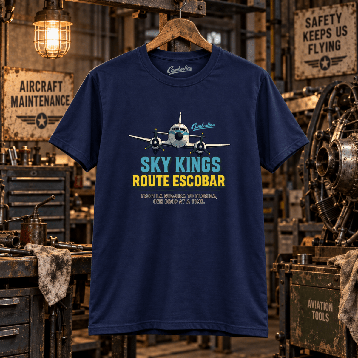 Navy Sky Kings Route Escobar aviation T-shirt in a gritty vintage aircraft workshop