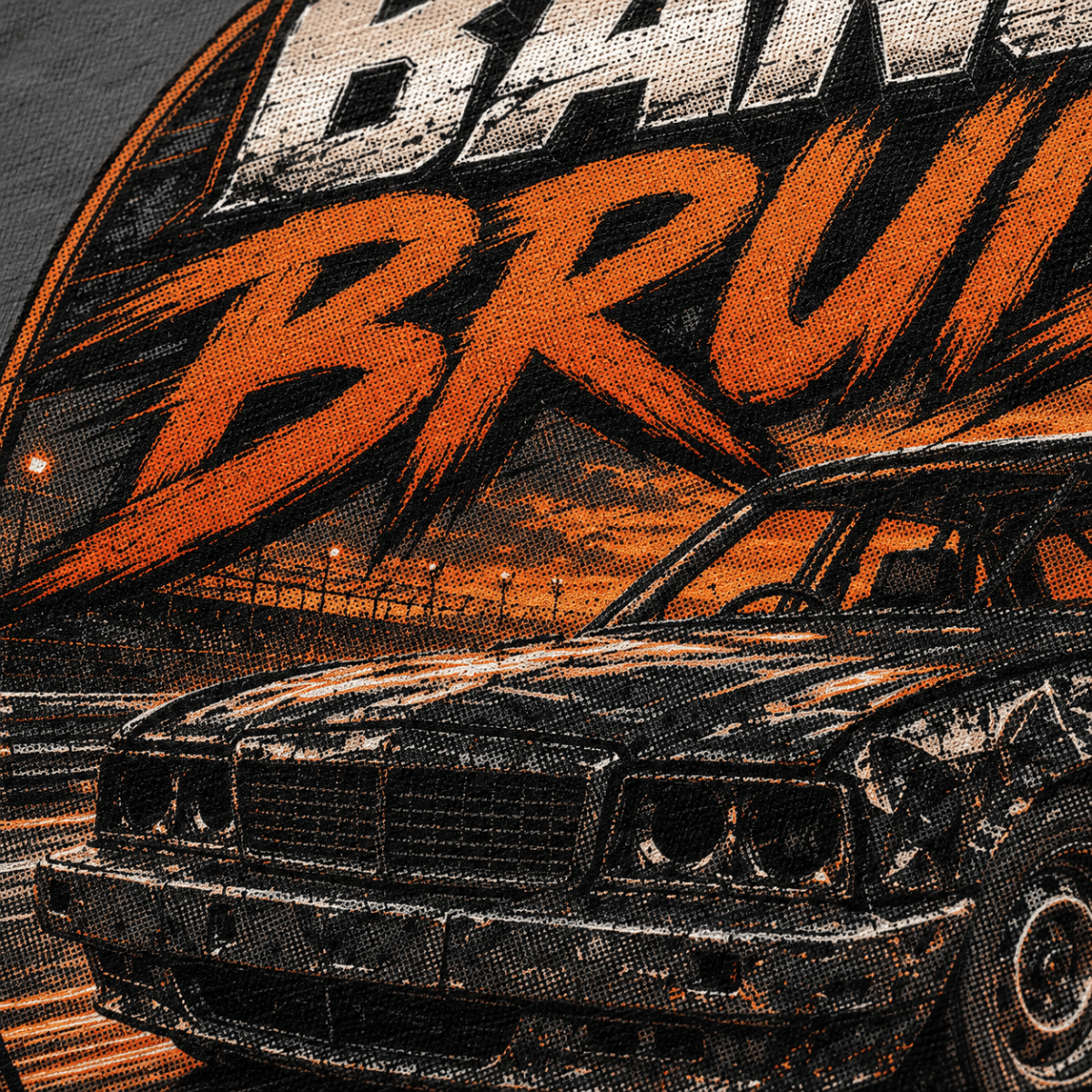 Close-up of a graphic print featuring a black race car and large orange and white stylized text on a dark background.