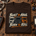 Brown Built to Haul lorry T-shirt folded on a fleet-service workbench