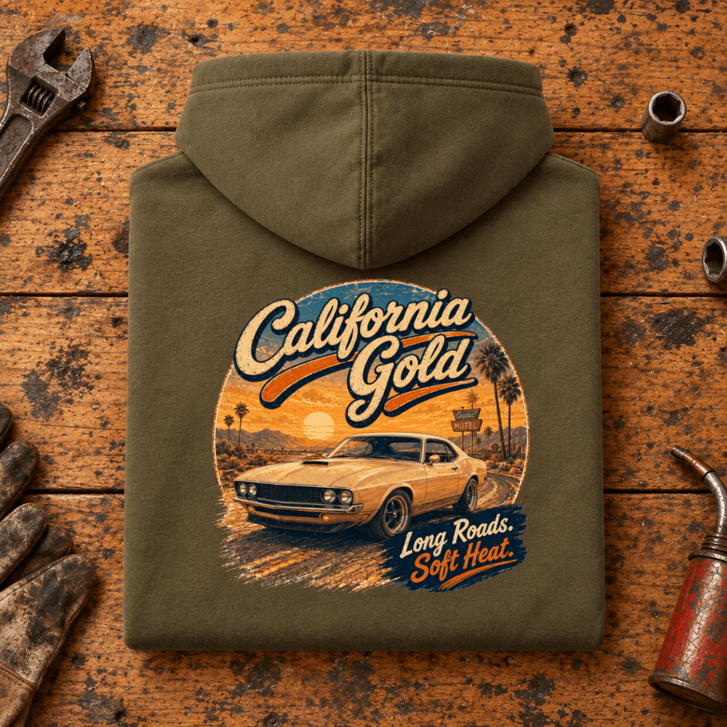 Camberline california gold classic muscle car combat green hoodie, folded rear view on a workshop bench with the complete graphic visible.