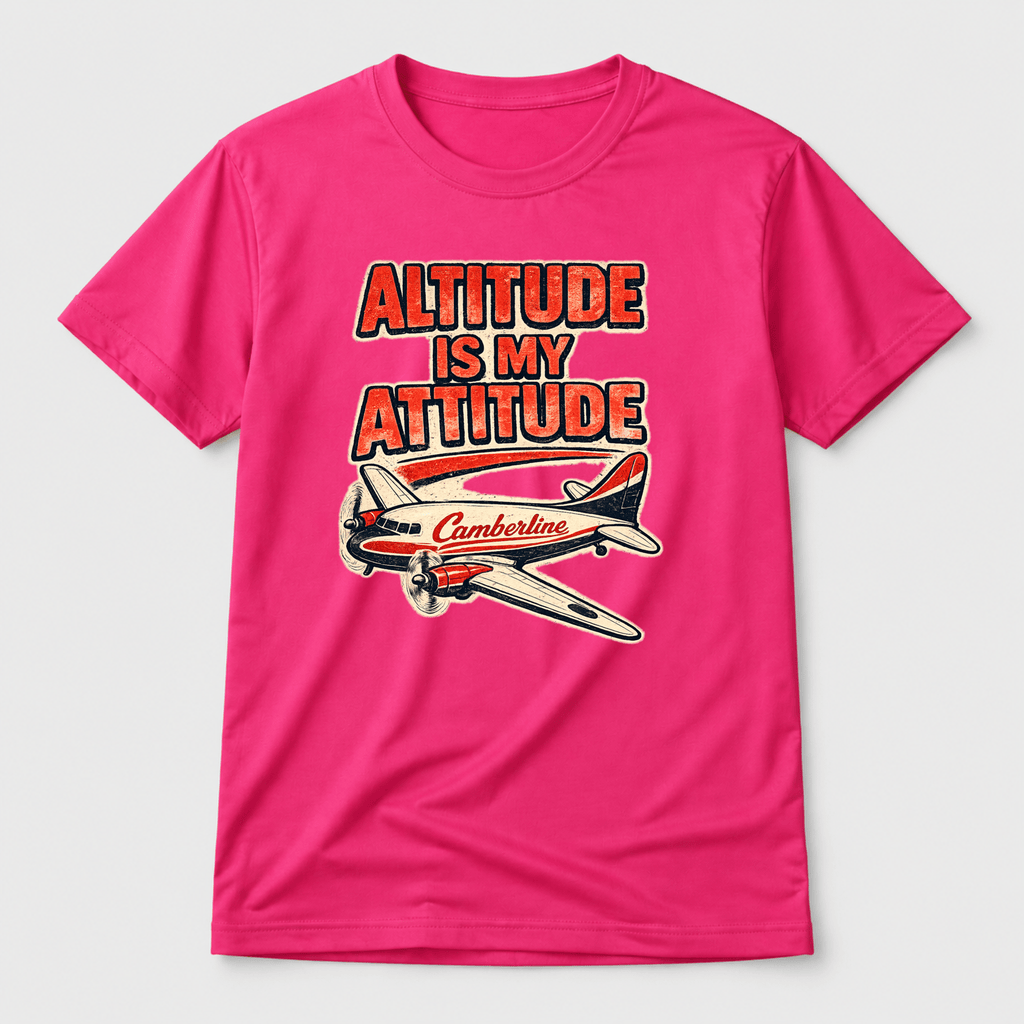 Pink t-shirt with airplane graphic and text 'Altitude is my attitude' on a white background