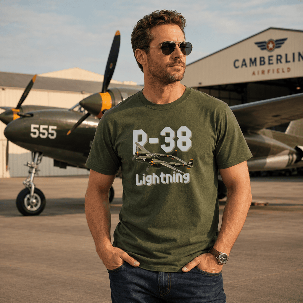 Man wearing a green t-shirt with 'P-38 Lightning' design in front of an airplane at Camberley Airfield.