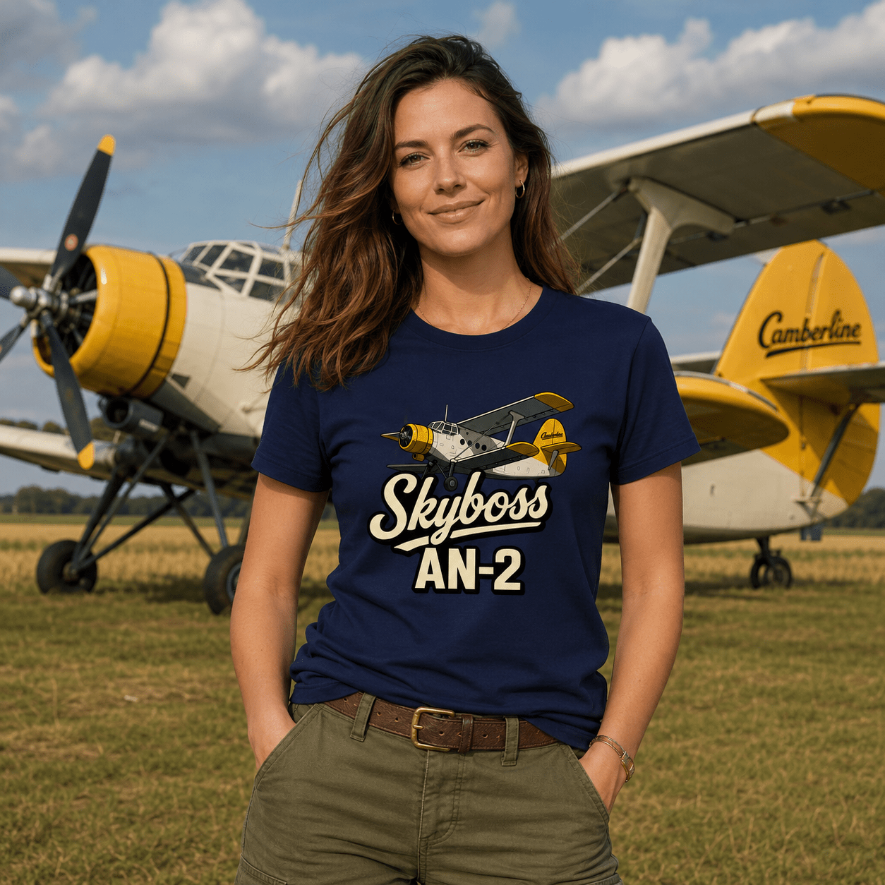 Woman wearing a 'Skyboss AN-2' t-shirt standing in front of a biplane.
