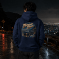 Model wearing the Camberline Cars Midnight Japan Classic Coupe Hoodie – Navy, styled in a car culture setting