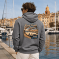 Model wearing the Camberline Cars Saint Tropez Classic Roadster Hoodie – Storm Grey, styled in a car culture setting