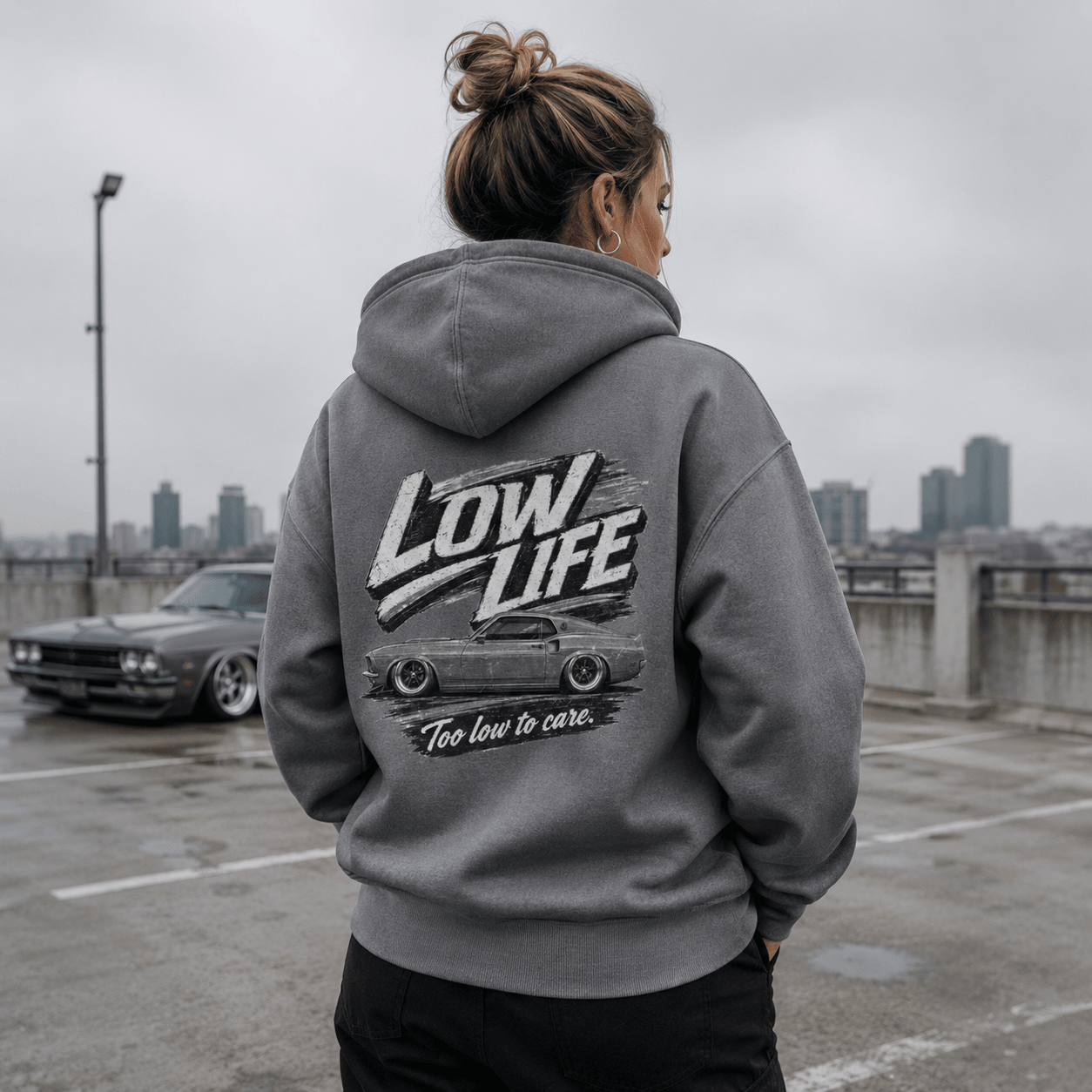 Model wearing Camberline Cars Low Life Monochrome Mach 1 Hoodie in Heather Grey