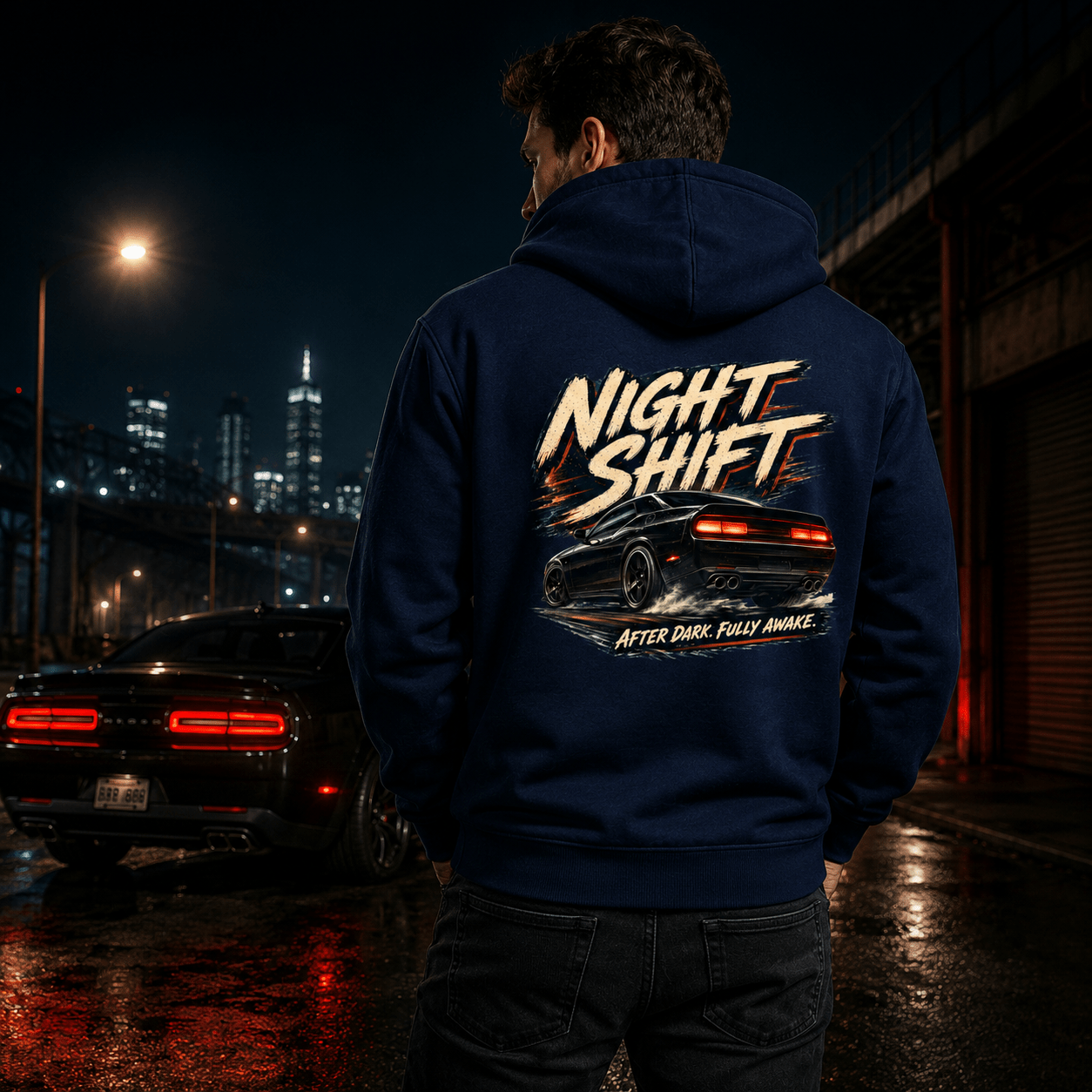 Model wearing the Camberline Cars Night Shift Muscle Car Hoodie – Navy, styled in a car culture setting