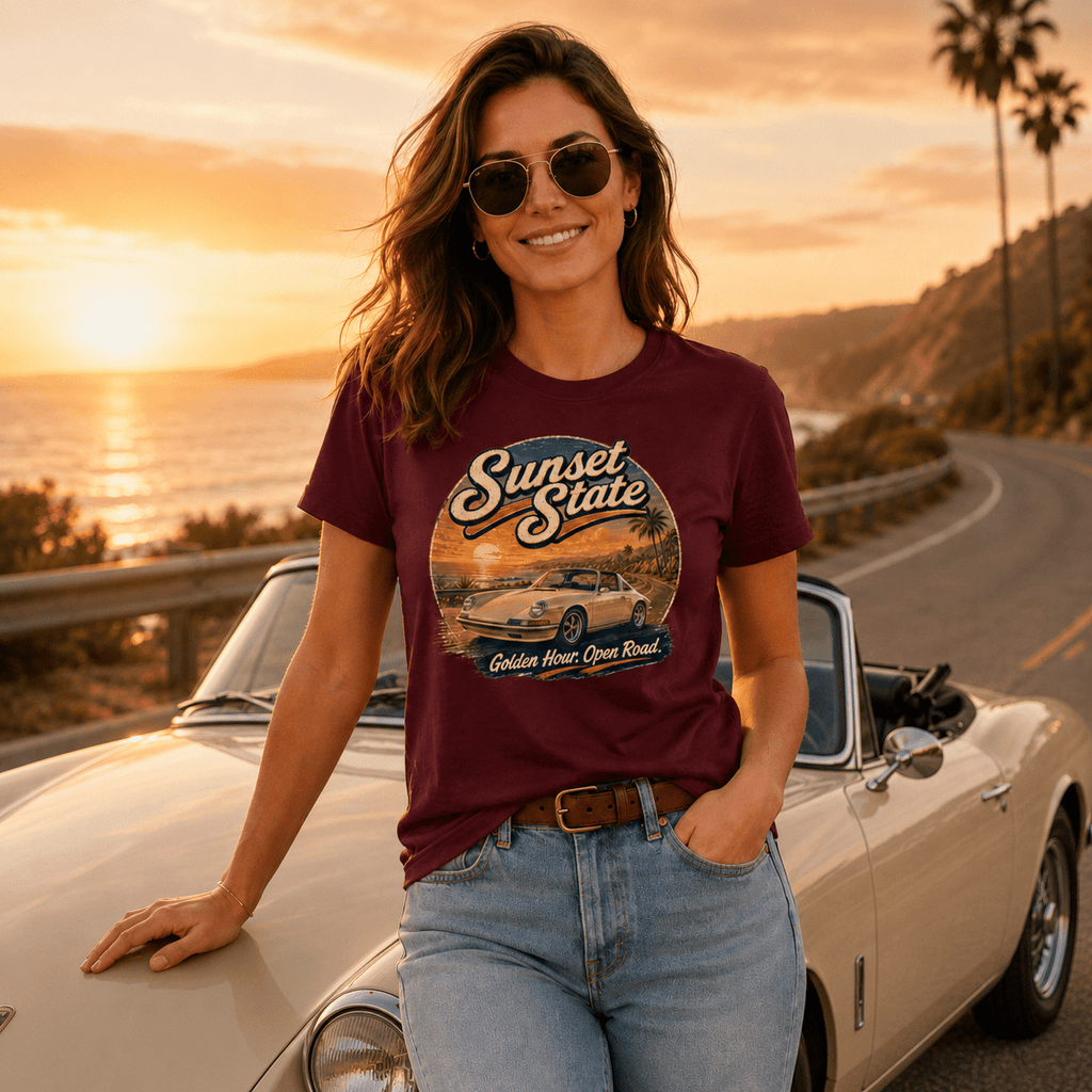 Model wearing the Camberline Cars Sunset State Classic Targa T-Shirt – Maroon, styled in a car culture setting