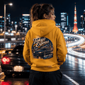 Model wearing Camberline Cars Tokyo Express Hoodie in Mustard