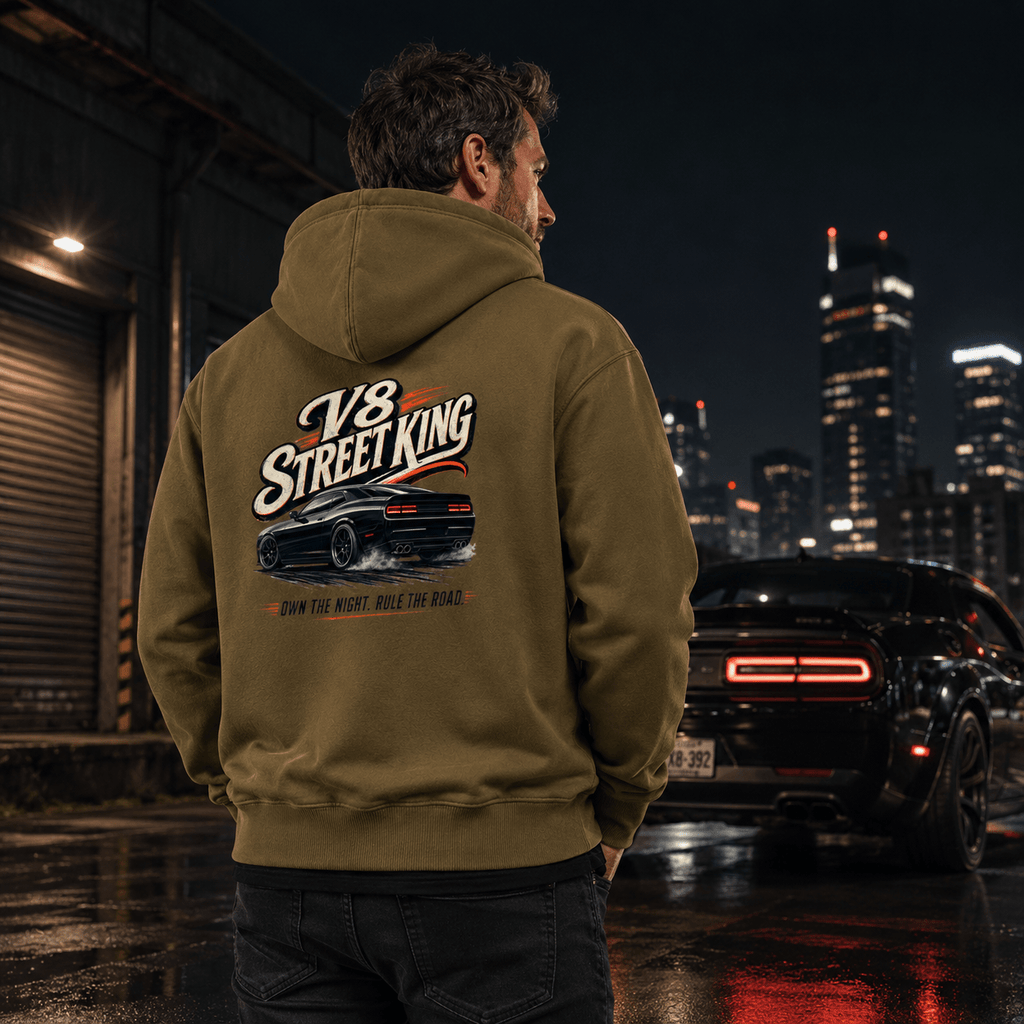 Model wearing the Camberline Cars V8 Street King Muscle Car Hoodie – Combat Green, styled in a car culture setting