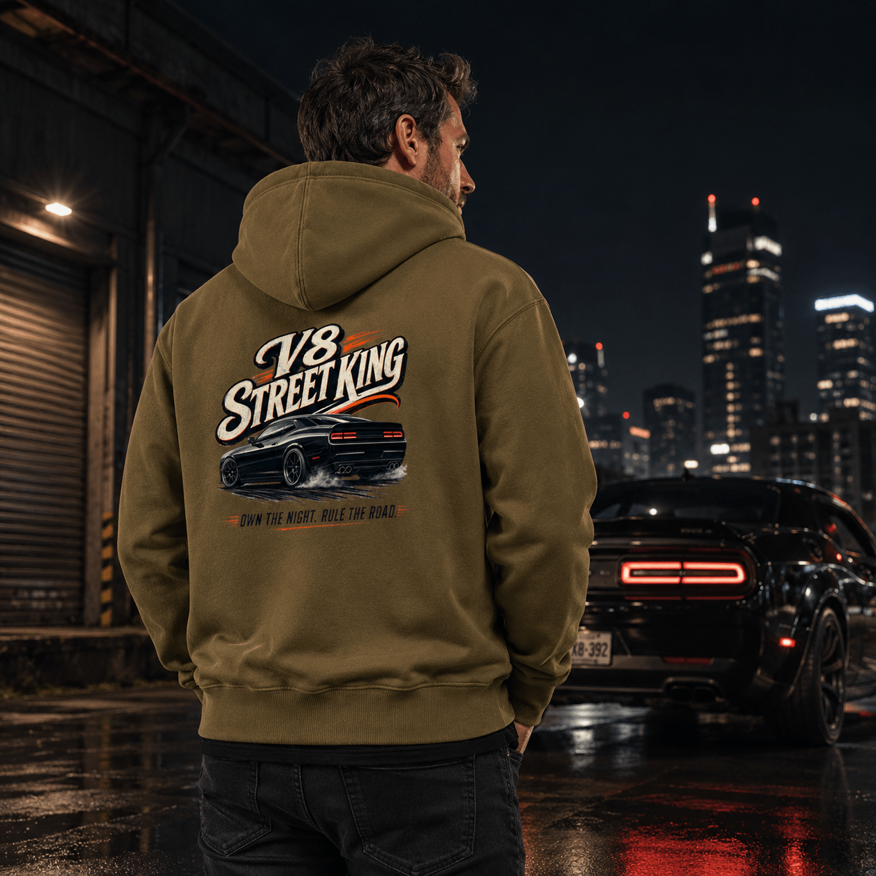 Model wearing the Camberline Cars V8 Street King Muscle Car Hoodie – Combat Green, styled in a car culture setting