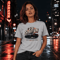Model wearing the Camberline Cars V8 Street King Muscle Car T-Shirt – Sport Grey, styled in a car culture setting