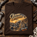 Camberline Chrome Season custom chopper brown T-shirt front print on a chrome bike-builder bench