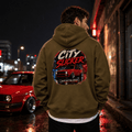 Model wearing Camberline Cars City Slicker Small Shell Big Attitude Stance Hatchback Hoodie in Combat Green