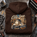 Camberline City Snap classic scooter brown hoodie back print in an urban workshop setting