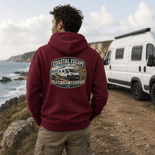 Model wearing Camberline burgundy van life hoodie showing Coastal Escape Van Life Society clifftop campervan badge on back