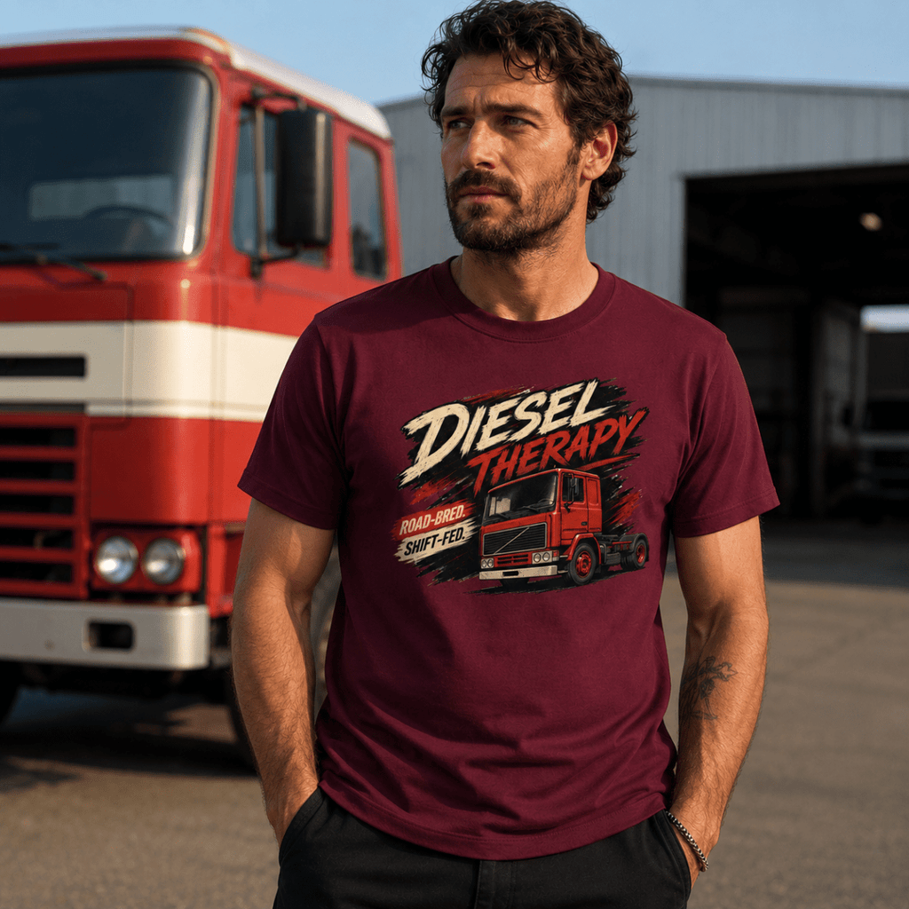Man wearing a 'Diesel Therapy' t-shirt standing in front of a red truck.