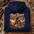 Camberline Dirt Bound enduro navy hoodie back print on a muddy paddock bench