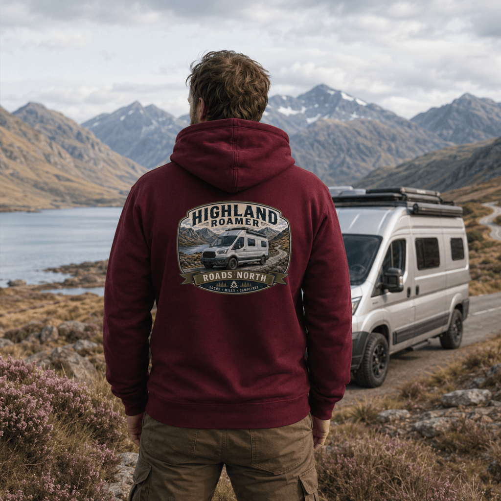 Model wearing Camberline burgundy van life hoodie showing Highland Roamer Roads North high-roof van and Scottish loch badge on back