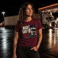 Woman wearing a Maroon t-shirt featuring an illustration of a white lorry driving at night under a crescent moon with the text Night Shift Hauler.