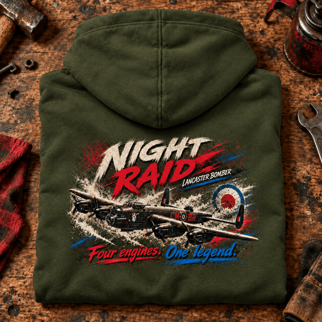 Lancaster Bomber Night Raid hoodie in Military Green, folded on a workshop bench, showing the back print