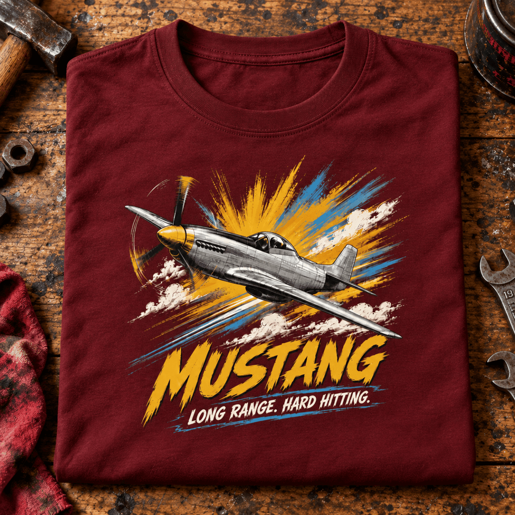 P-51 Mustang Fighter t-shirt in Burgundy, folded on a workshop bench, showing the front print