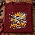 P-51 Mustang Fighter t-shirt in Burgundy, folded on a workshop bench, showing the front print