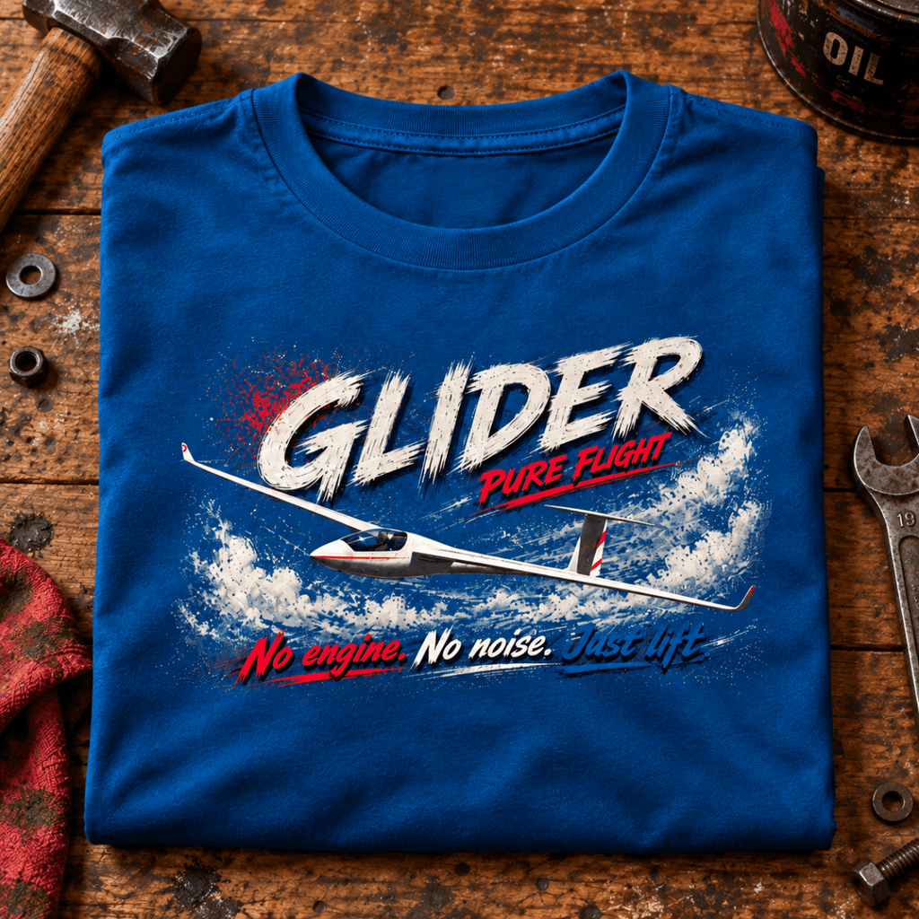Glider Pure Flight t-shirt in Sapphire Blue, folded on a workshop bench, showing the front print