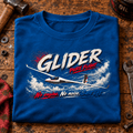 Glider Pure Flight t-shirt in Sapphire Blue, folded on a workshop bench, showing the front print