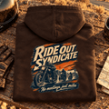 Camberline Ride Out Syndicate hot chocolate motorcycle hoodie back print at a rugged desert-road stop