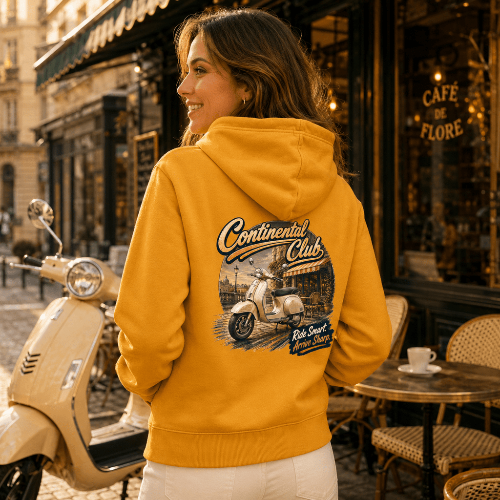 Model wearing the Camberline Riders Continental Club Vintage Scooter Hoodie – Mustard, showing the Riders back graphic in a motorcycle-inspired setting
