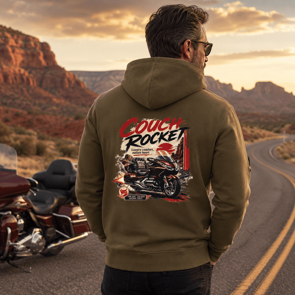 Model wearing the Camberline Riders Couch Rocket Luxury Tourer Motorcycle Hoodie – Khaki, showing the Riders back graphic in a motorcycle-inspired setting