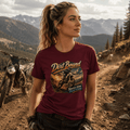 Model wearing the Camberline Riders Dirt Bound Motocross Dirt Bike T-Shirt – Burgundy, showing the Riders front graphic in a motorcycle-inspired setting