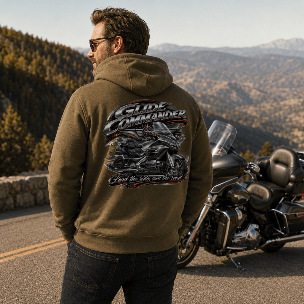 Model wearing the Camberline Riders Glide Commander Luxury Tourer Hoodie – Khaki, showing the Riders back graphic in a motorcycle-inspired setting