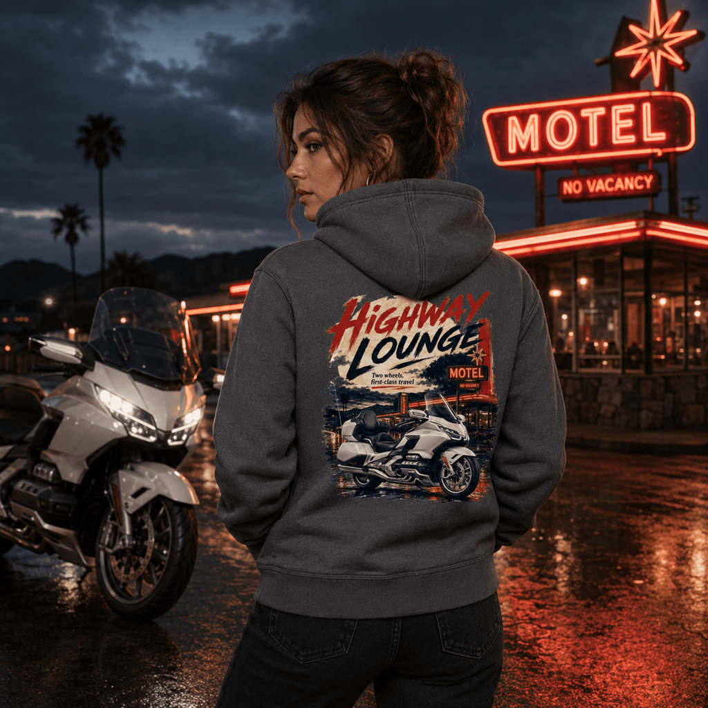 Model wearing the Camberline Riders Highway Lounge Touring Motorcycle Hoodie – Charcoal, showing the Camberline Riders graphic in a motorcycle-inspired setting