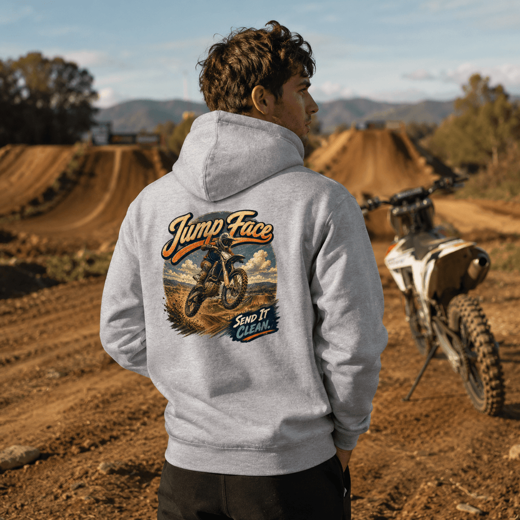 Model wearing the Camberline Riders Jump Face Motocross Dirt Bike Hoodie – Heather Grey, showing the Camberline Riders graphic in a motorcycle-inspired setting