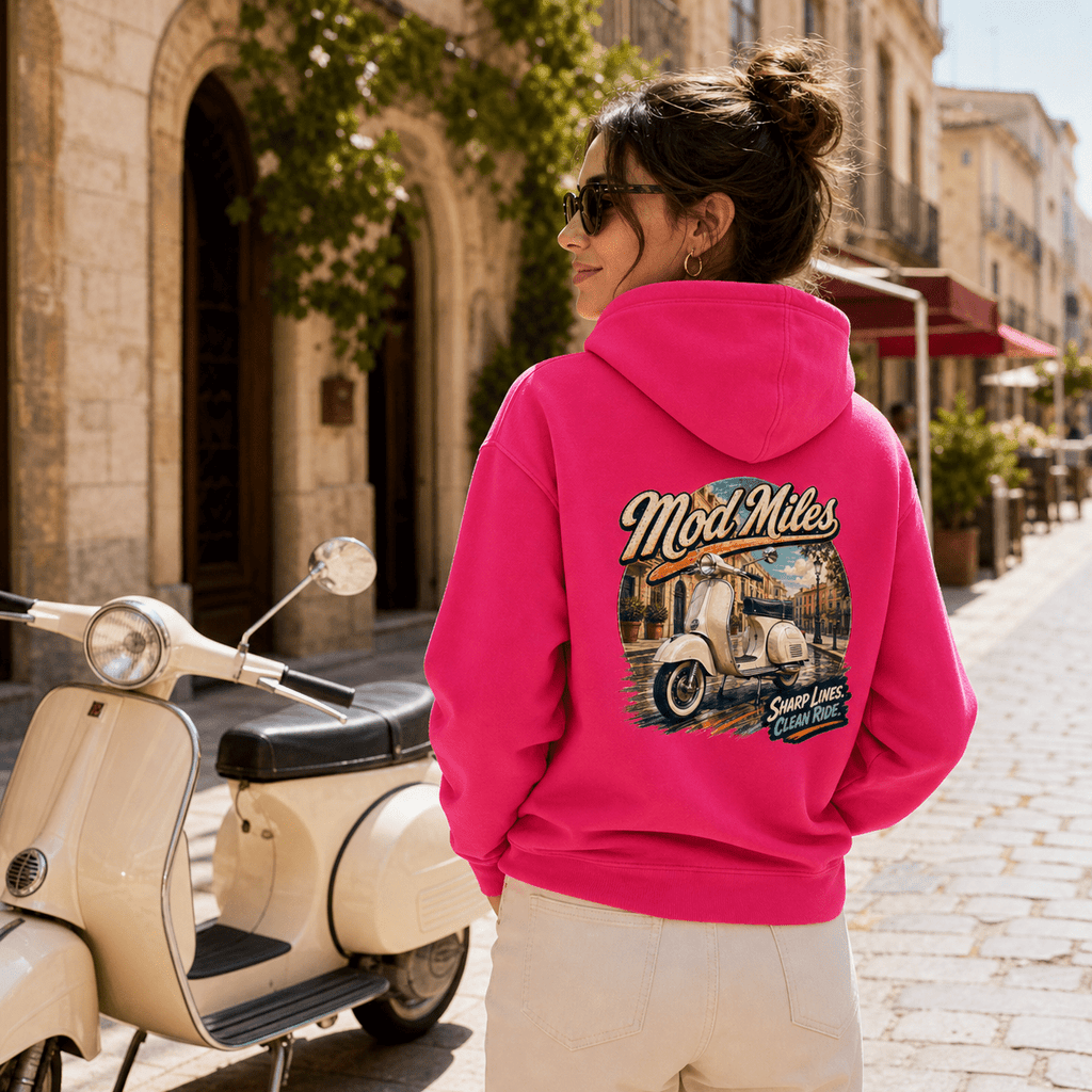 Model wearing the Camberline Riders Mod Miles Classic Scooter Hoodie – Hot Pink, showing the Camberline Riders graphic in a motorcycle-inspired setting